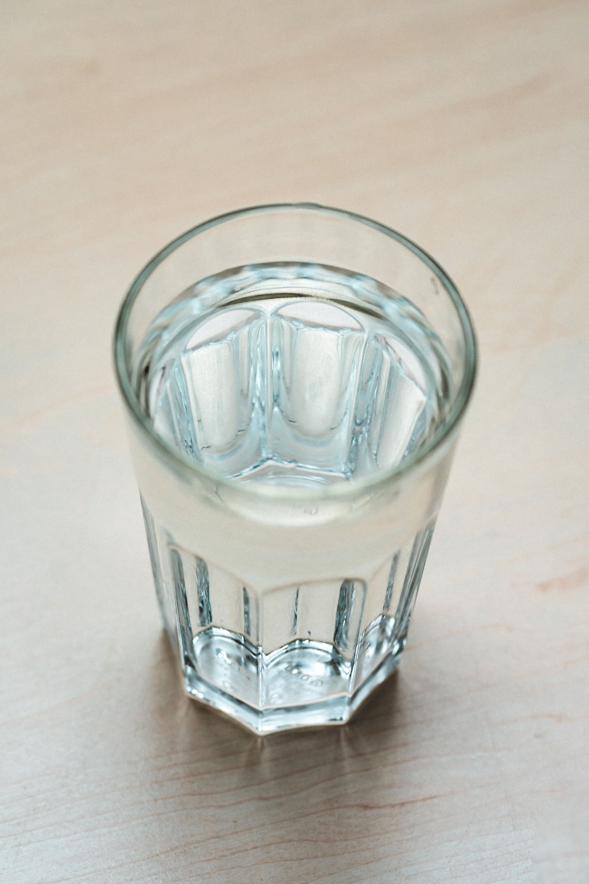 Glass of water on a wooden table
