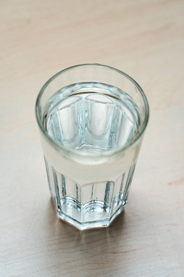 Glass of water on a wooden table