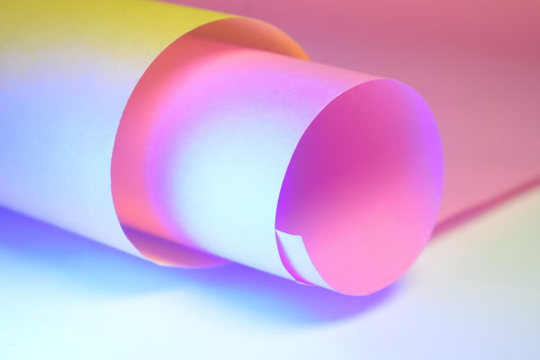 A sheet of paper curled into a tube