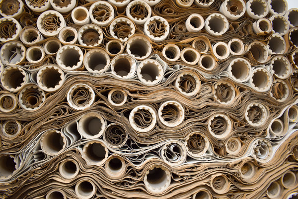 Stacked rolls of paper seen from the end
