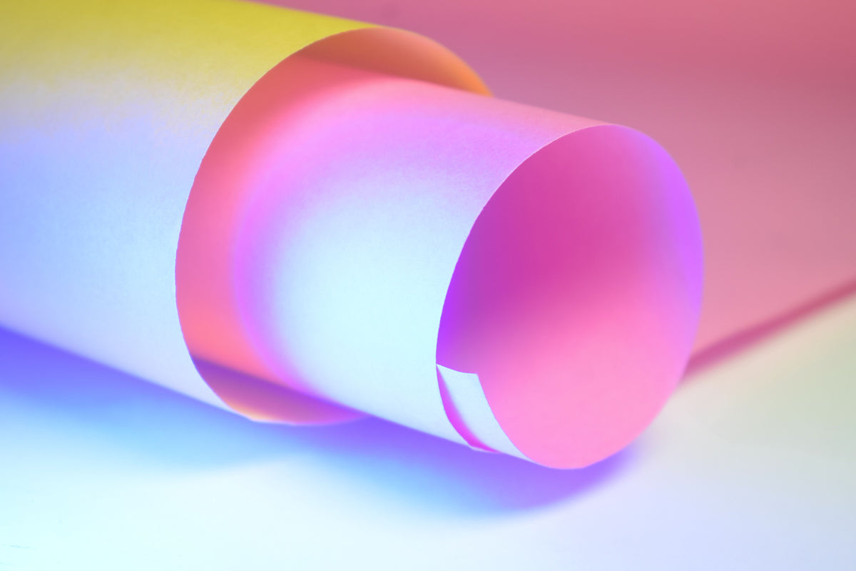 A sheet of paper curled into a tube