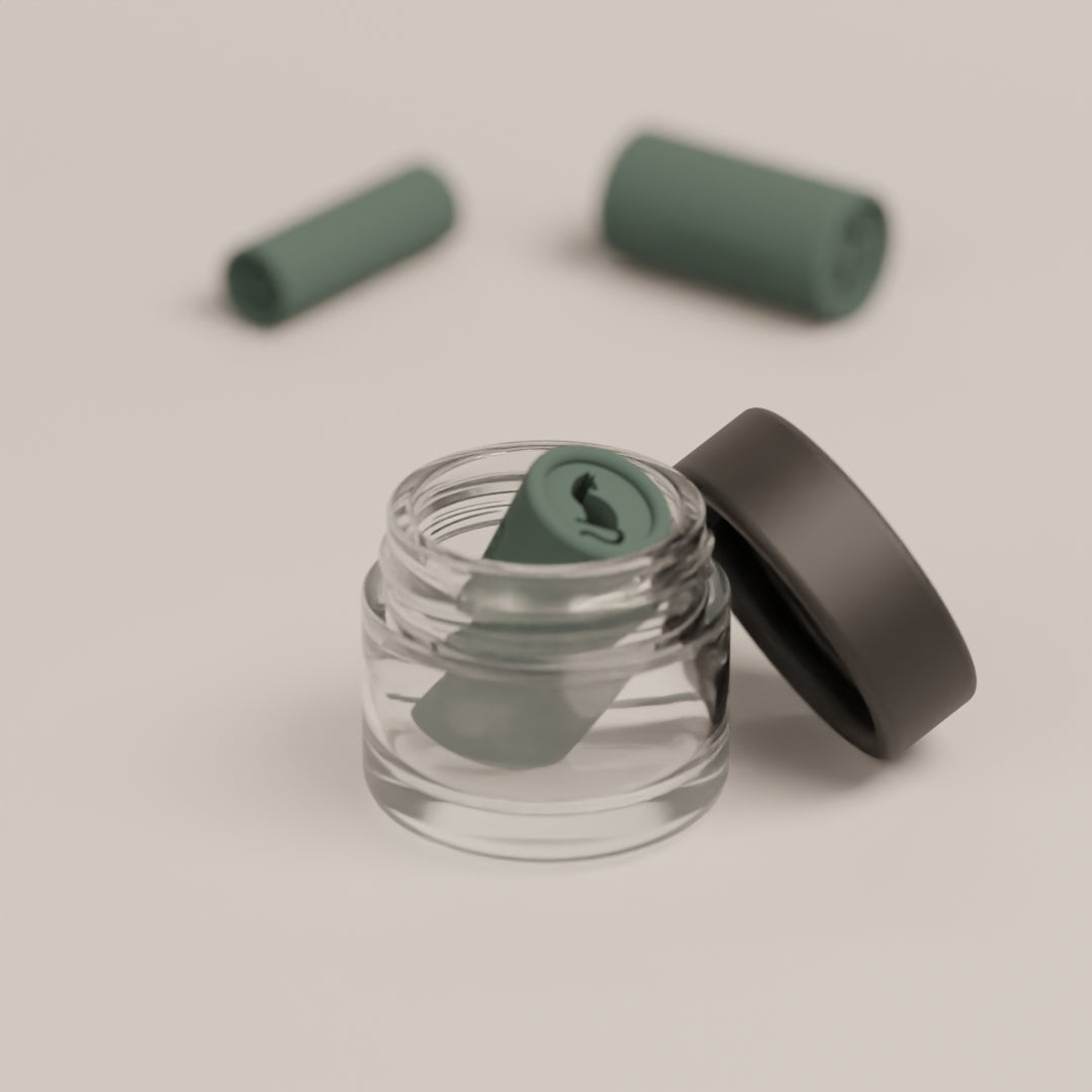 Reusable filter tip with the Bastet cat design shown inside the cleaning case for easy maintenance