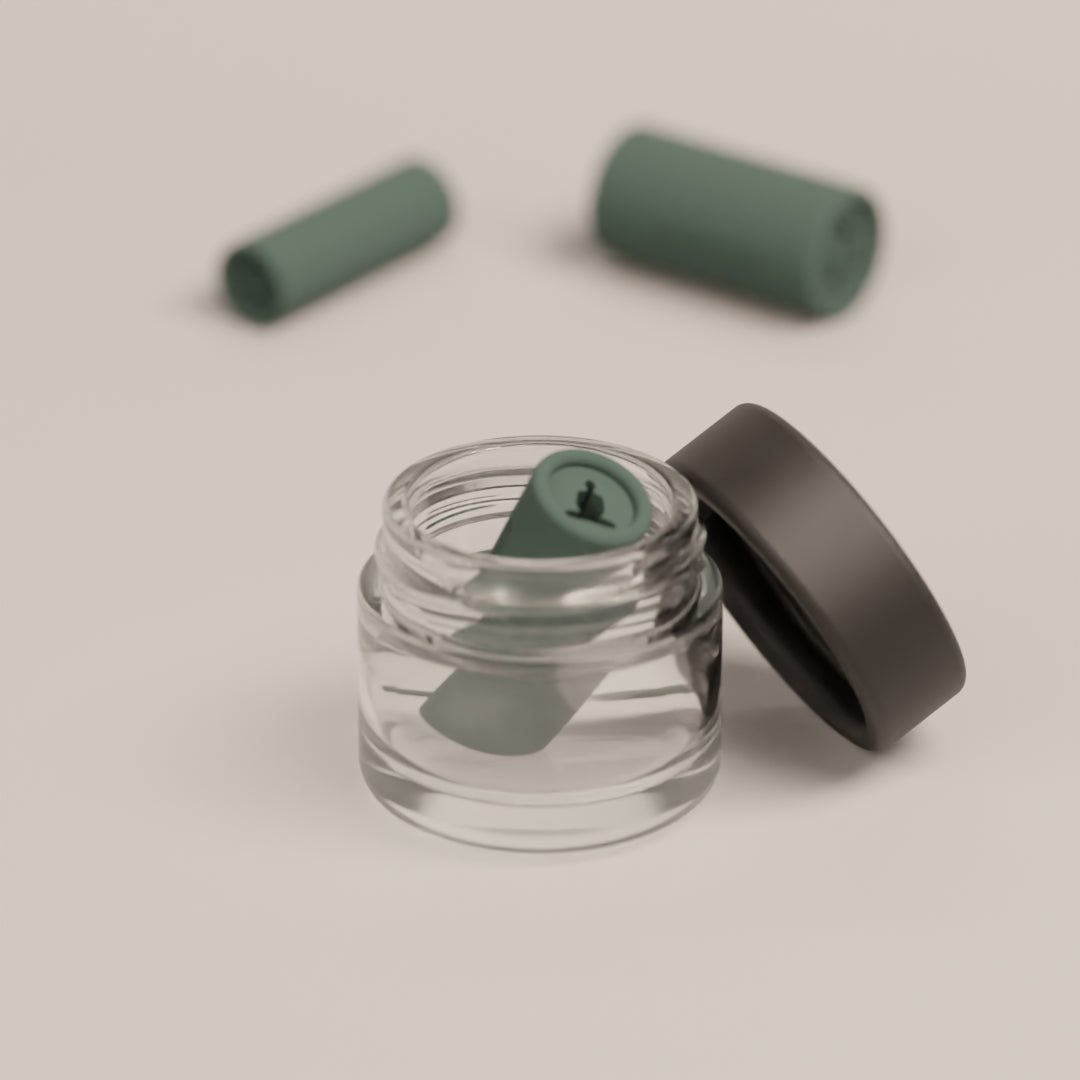 Reusable filter tip with the meditation design shown inside the cleaning case for easy maintenance